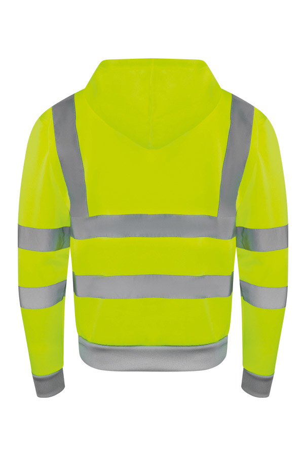 Erwachsener in signalgelbem Korntex-Hoodie mit Zipper und Reflexstreifen in einem industriellen Umfeld
