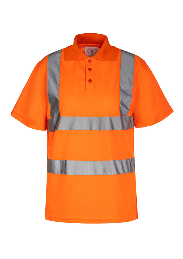 Erwachsener Bauarbeiter steht in fluoreszierendem gelben Korntex Polo-Shirt mit Funkgerät vor einem zerstörtem Gebäude