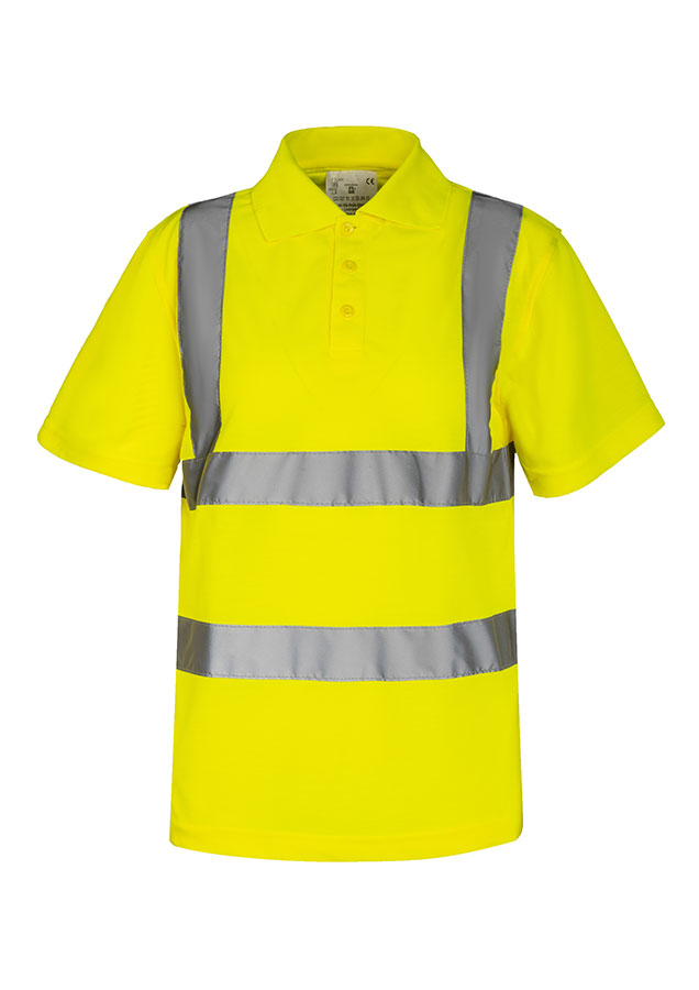 Erwachsener Bauarbeiter steht in fluoreszierendem gelben Korntex Polo-Shirt mit Funkgerät vor einem zerstörtem Gebäude