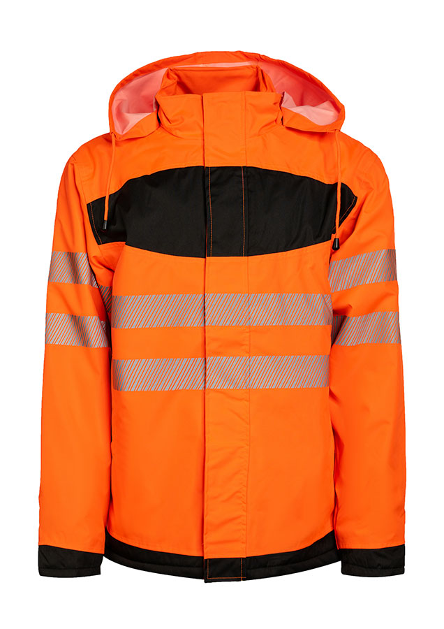 Erwachsener in signalgelbem Korntex-Parka mit schwarzer Brustpartie und Reflexstreifen in einem industriellen Umfeld