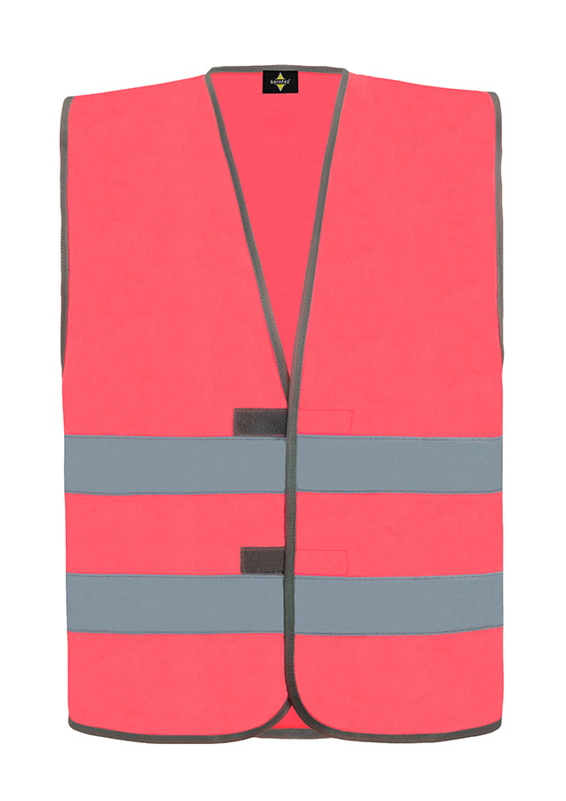 Erwachsener in neonpinker Korntex Warnweste in einem industriellen Umfeld